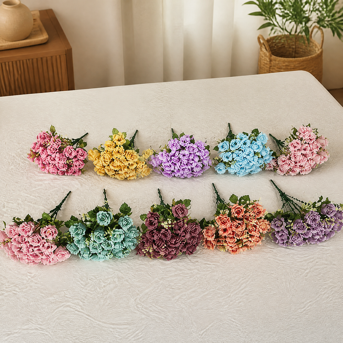 Assorted small artificial rose bouquets in a two-colour mix