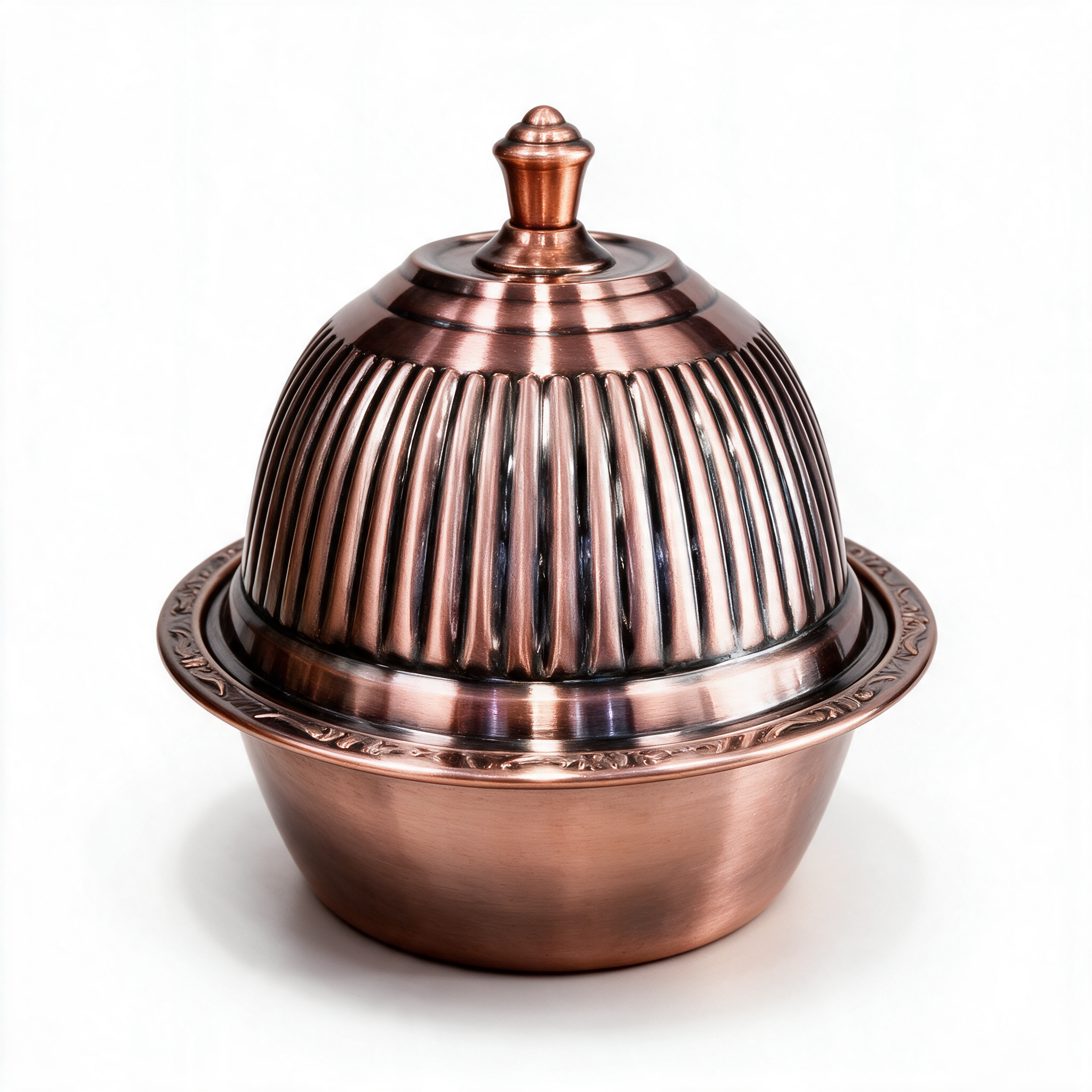 Copper-tone covered serving bowl with fluted domed lid, on a white background
