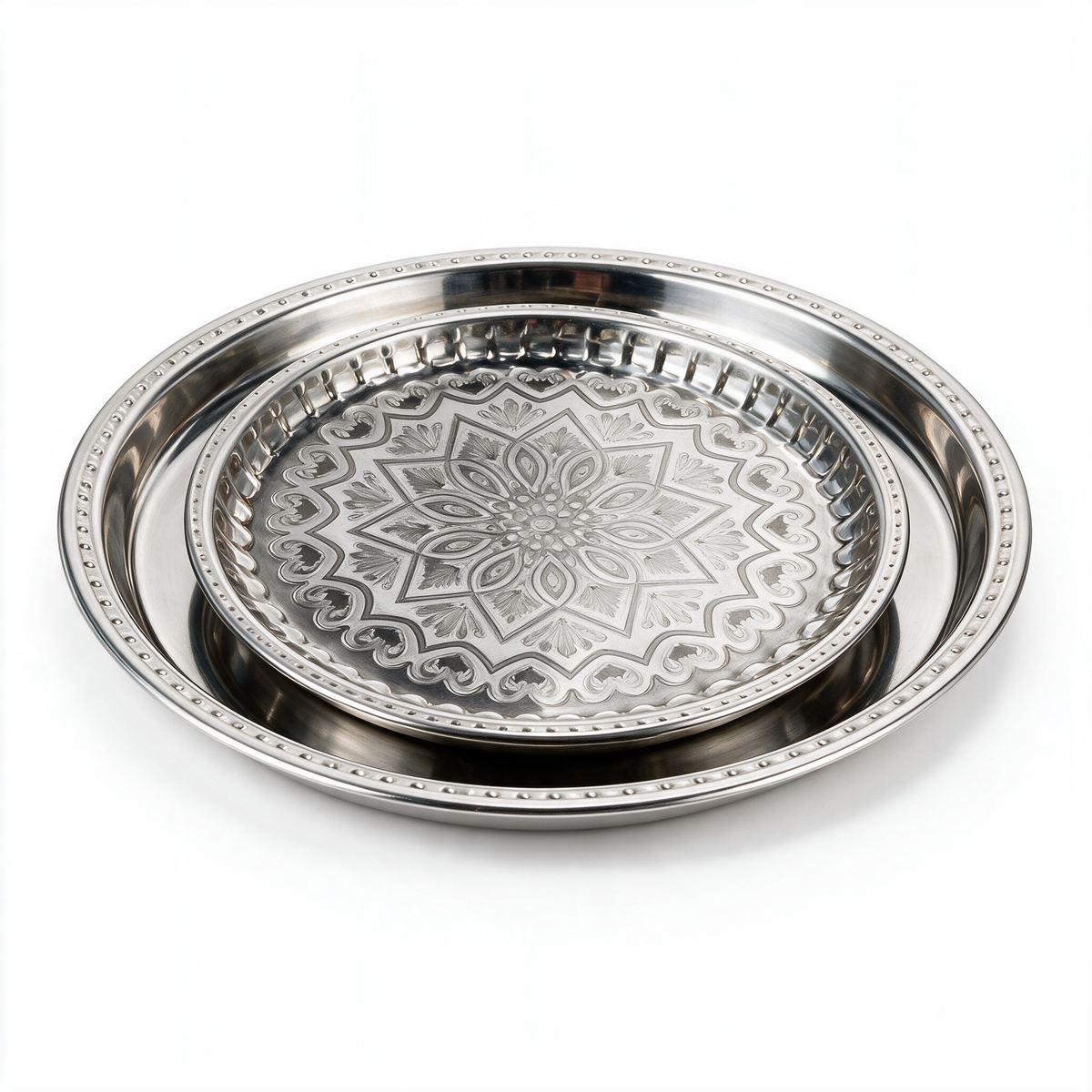 Two round polished silver serving trays nested, beaded rims and engraved eight-point star medallion