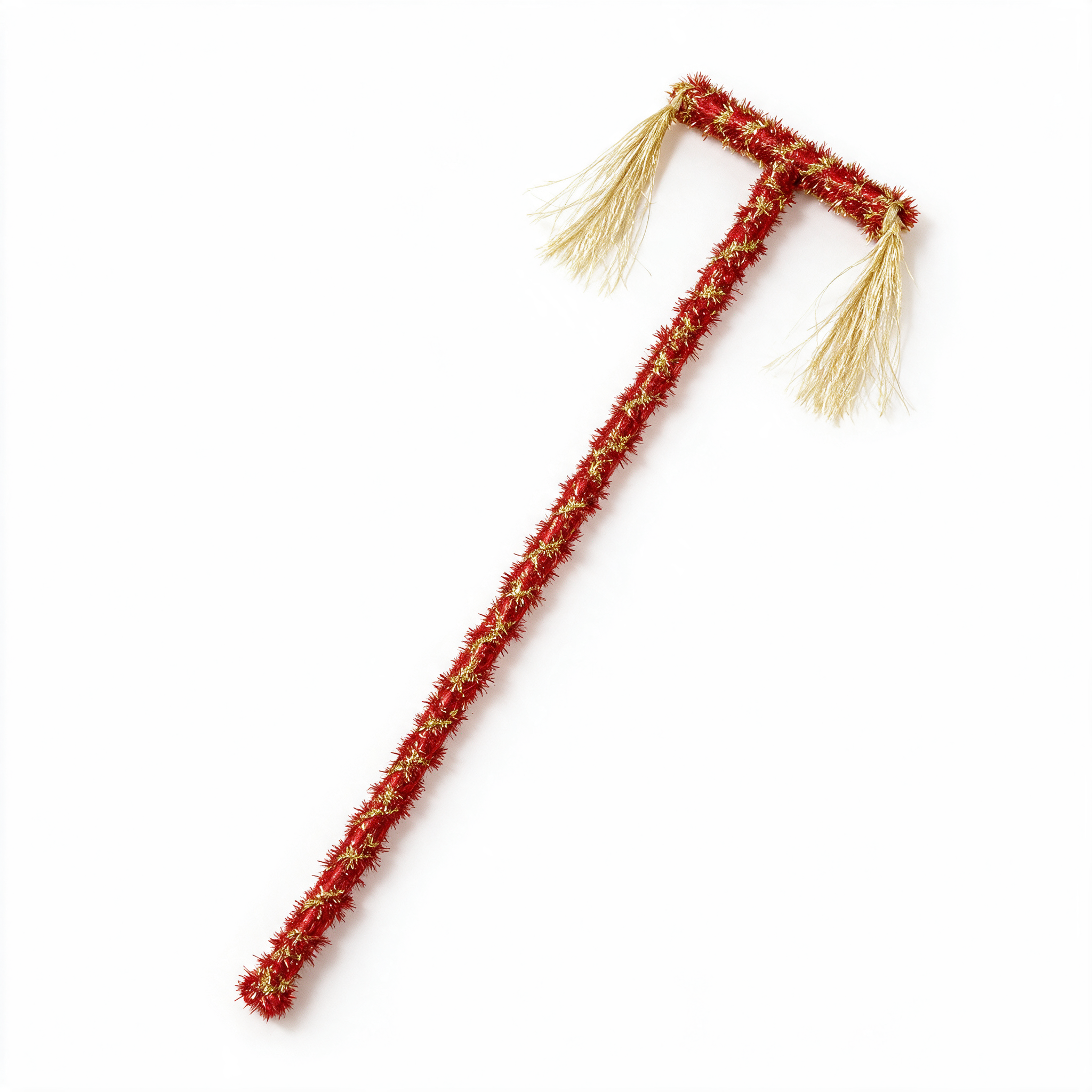 Red celebration cane wrapped in red and gold tinsel, with two pale tassels at its T-shaped head