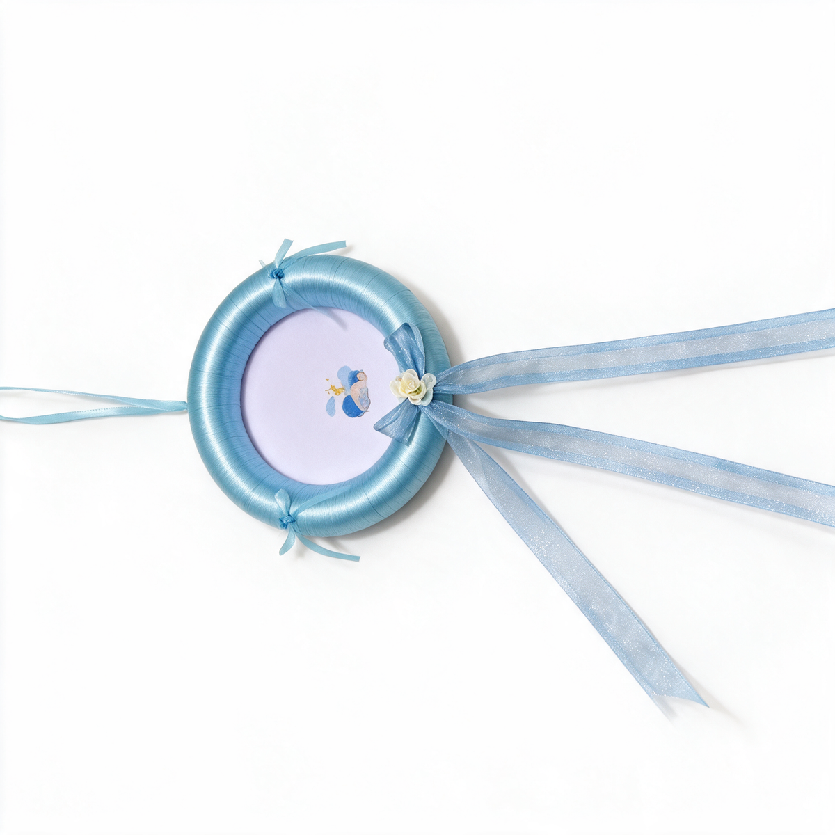 Light blue satin hoop decoration with organza bow, cream rose and streamers, small baby motif at centre